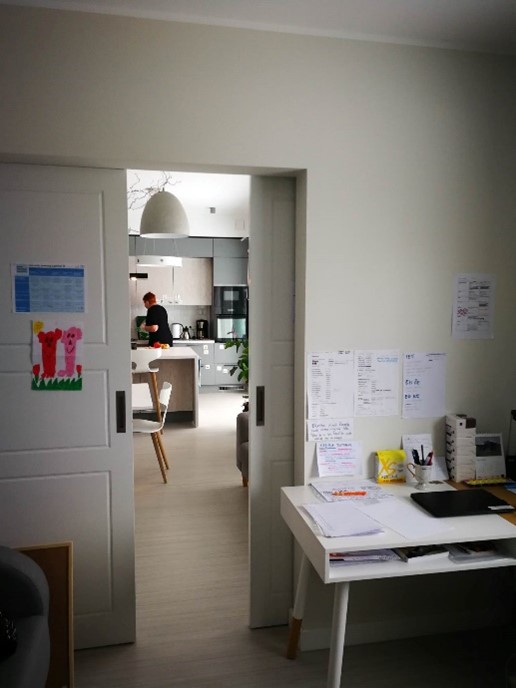 a person standing in a kitchen