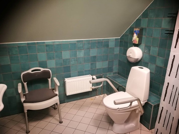 a bathroom with blue tiles